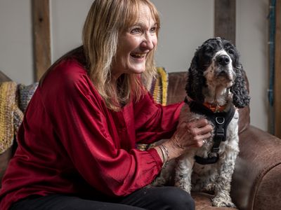 Freedom project foster volunteer Chrissie with a spaniel