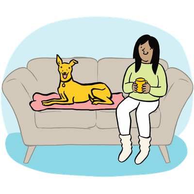 Illustration of a yellow Lurcher dog sitting on sofa with lady owner holding a mug