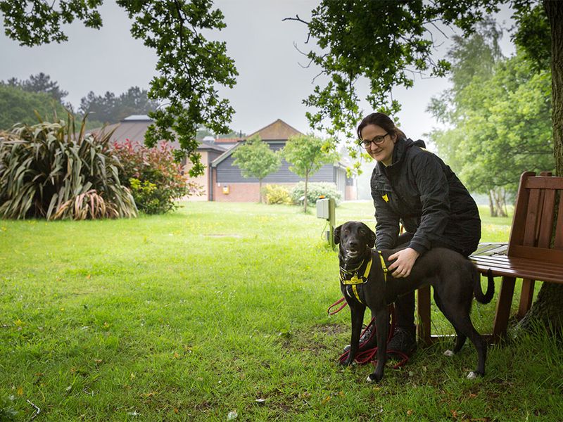 Canterbury Rehoming Centre exterior with Canine Carer and black labrador cross