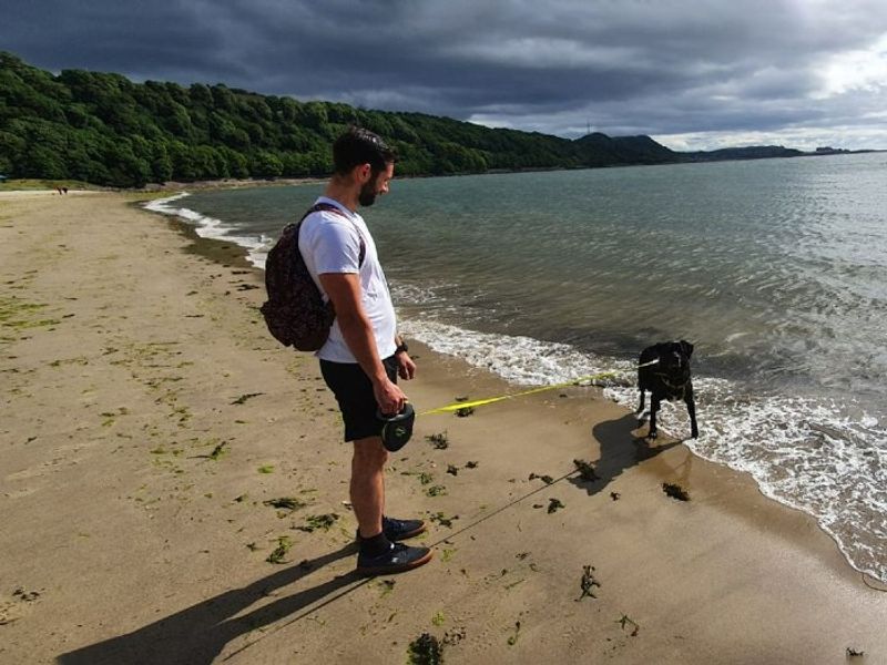 Bart the Foster Carer with foster dog Buddy at the beach