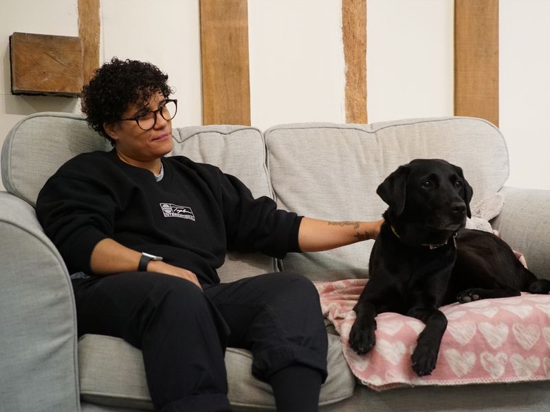 Dog and owner on sofa