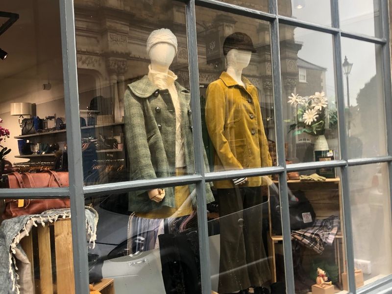 Shop window with some dressed mannequins