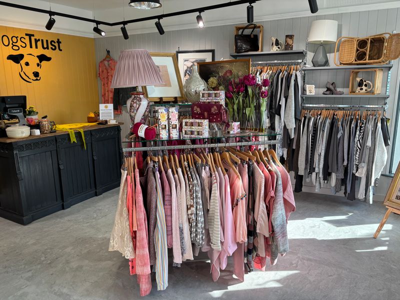 wells charity shop floor area with clothes